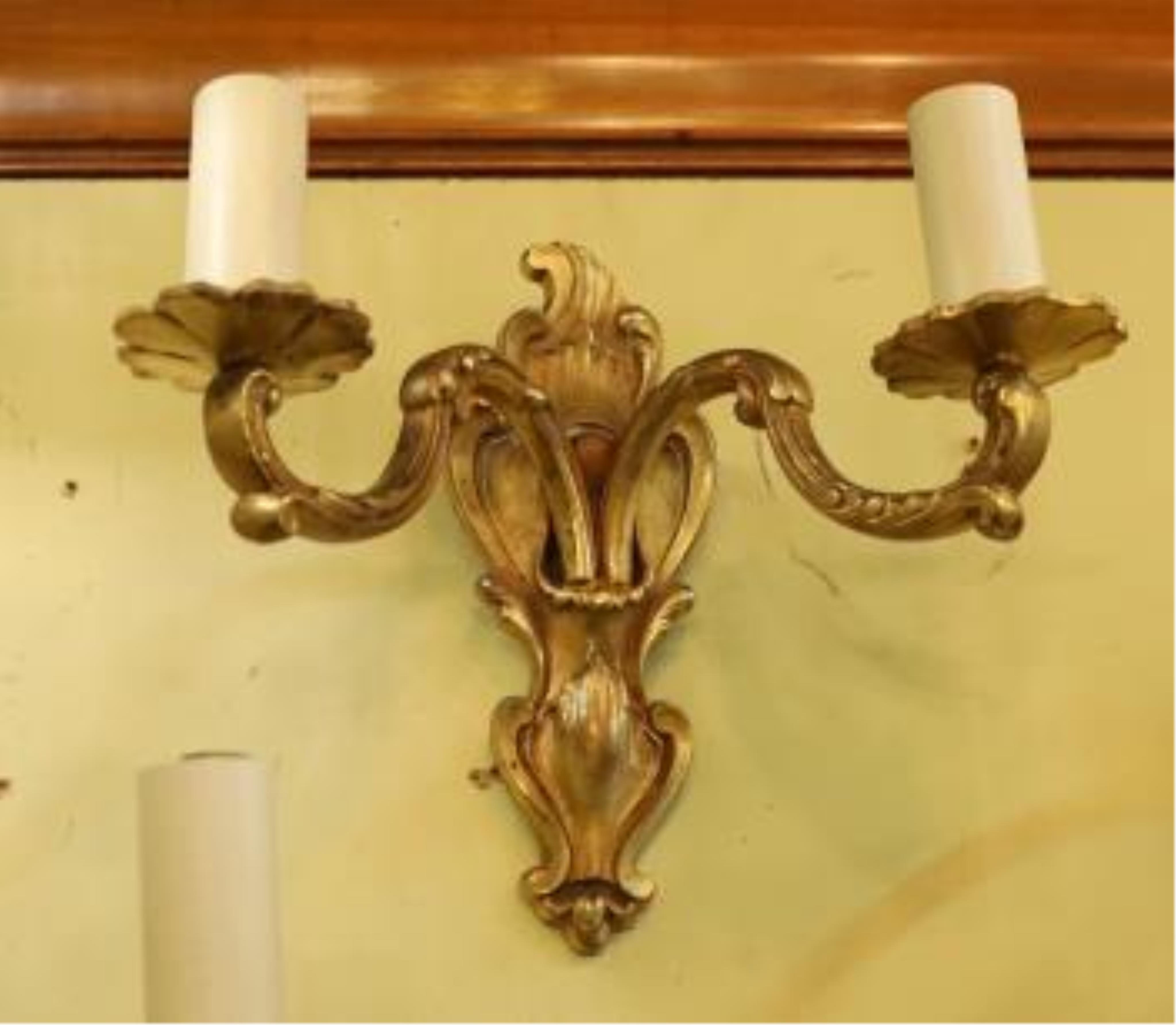 A pair of late 19th century French ormolu twin branch wall lights, 21cm high. Condition - fair to good